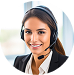 A woman wearing a headset and a business suit smiles at the camera, representing a virtual receptionist in an office environment with a blurred background.